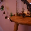 Amazon Christmas pinecone light string, bell decoration, led pine needle copper wire light, red fruit decorative light string Application Scenario